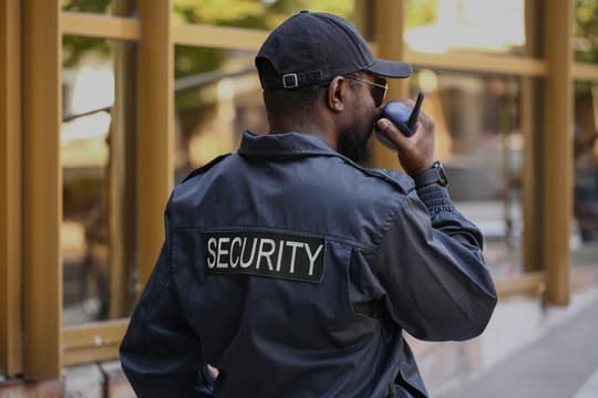 Security guard on radio communication at a residential estate